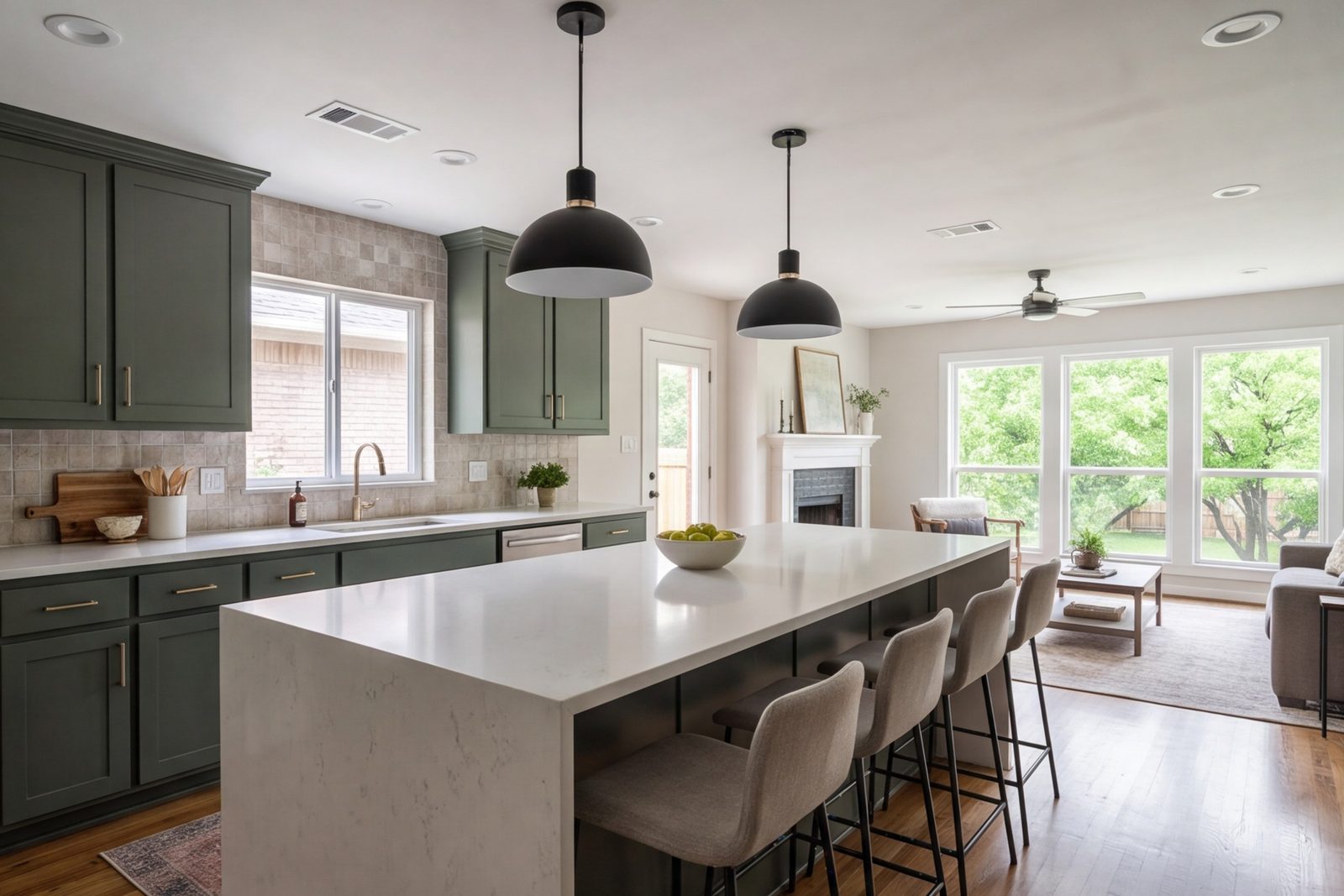 Richardson kitchen opened to the family room with a long island and pendant lights